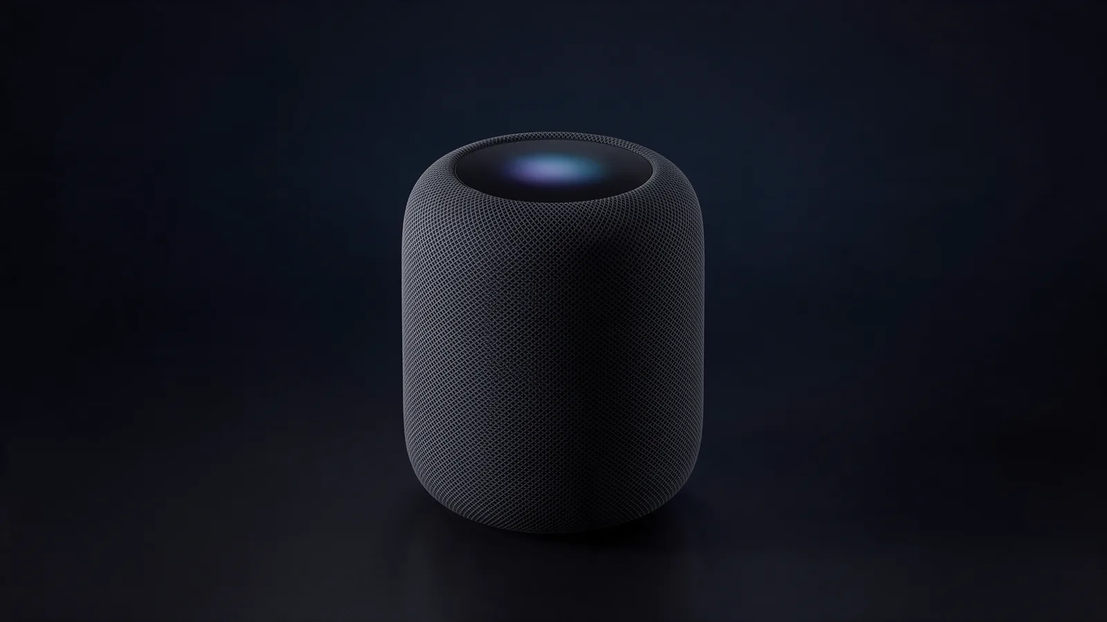 The Alexsay speaker: a charcoal fabric cylinder with a softly glowing top